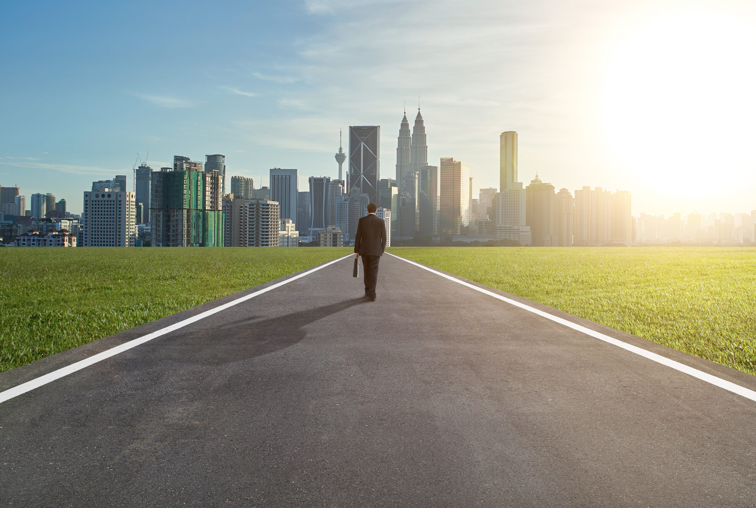 Graphicstock image of male entrepreneur walking on the road while carrying suitcase sorxtovxse scaled
