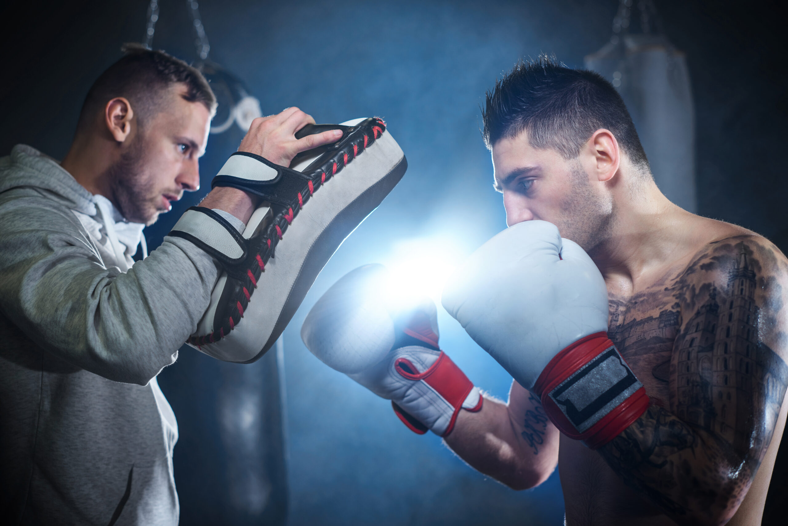 Unlocking Your Potential: The Ultimate Guide To Personal Development 3 Storyblocks male boxer sparring with personal trainer rdusi1fcm scaled